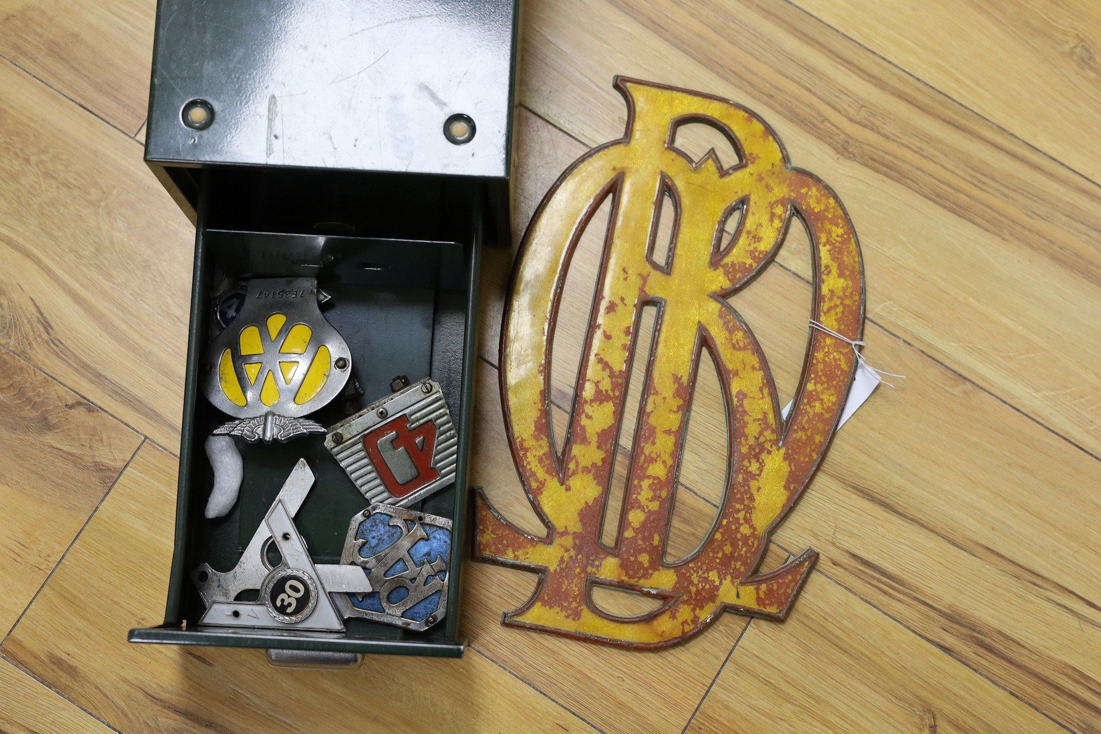 An selection of assorted car badges